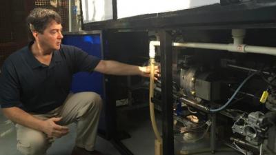 Brian Stoner with one of the prototype sanitation systems