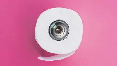 Toilet paper roll with camera lens